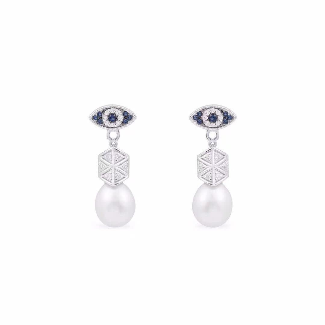 APM Monaco Elegant Pearl and Sapphire Eye Stud Earrings
